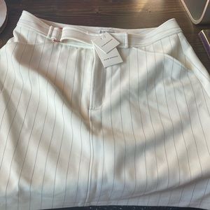 Club Monaco size six mini skirt with buckle. New with tags